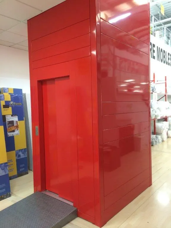 Glossy red OnLevel EV8 lift shaft installed inside a retail interior