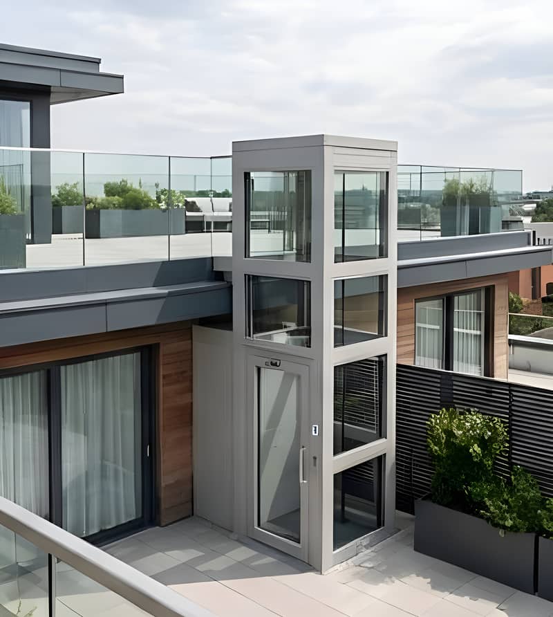 An external glazed OnLevel platform lift serving a rooftop terrace on a modern commercial building